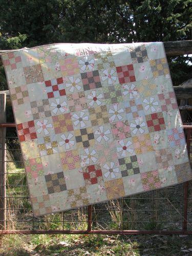Hatched and Patched Mill Flower Quilt